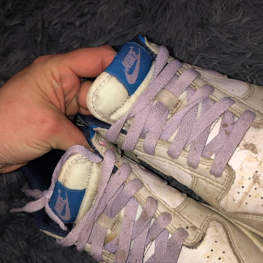 Well worn women’s Nike White dunks sneakers with Light Purple Accents WW